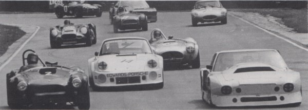 image Aston Martins and Porsches in an Inter-Marque Race