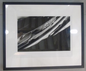 Framed photograph showing a close up of the lettering on an Aston Martin V12 Engine